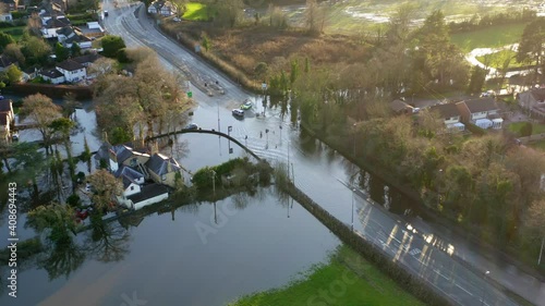 Hooton cross roads flooded by storm christoph. 

Drone orbit shot showing police vehicles blocking roads. photo