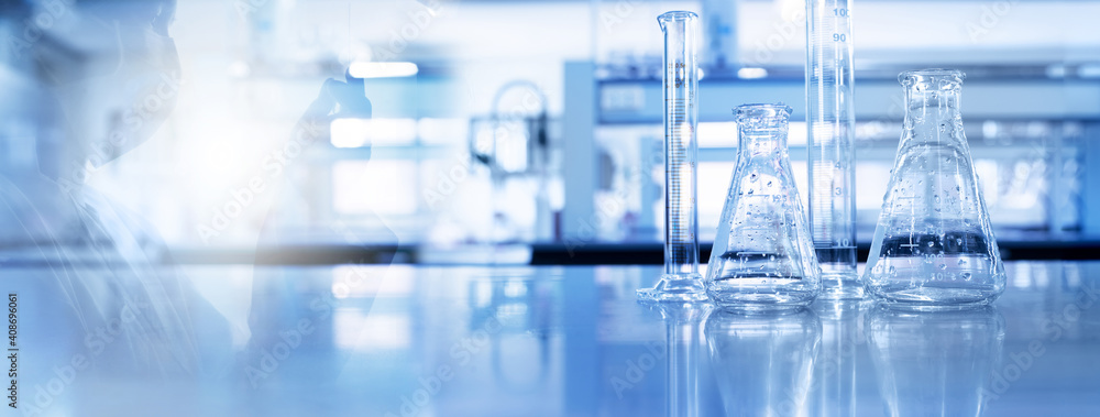 shadow of scientist and glass flask and cylinder in medical science lab  blue banner background Stock Photo | Adobe Stock