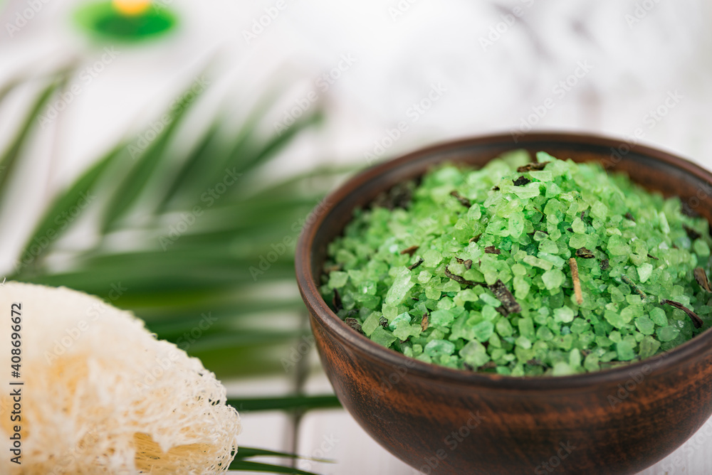 Spa. Green herbal spirulina salt in ceramic bowl, spa towels, candles and bamboo Spa. Green herbal spirulina salt in ceramic bowl, spa towels, candles and bamboo