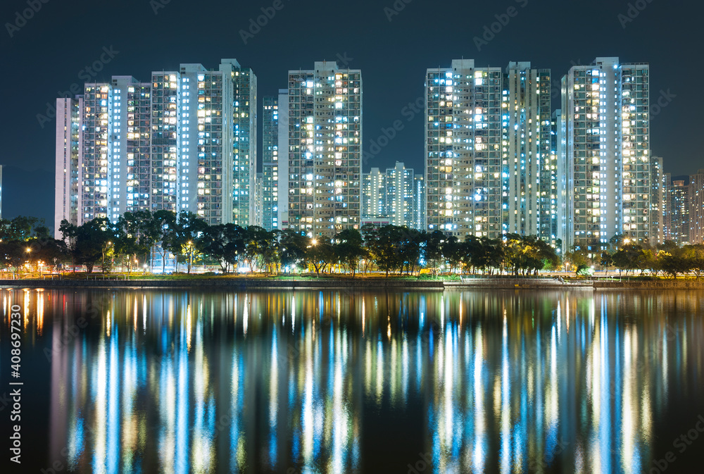 Naklejka premium high rise residential building in Hong Kong city at night