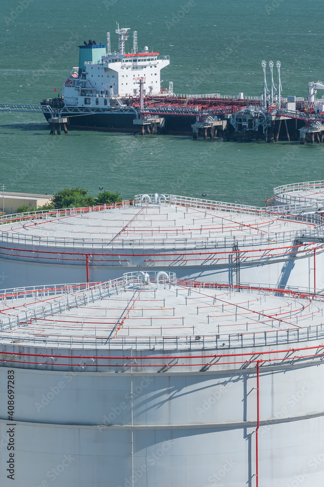 Oil Storage tank and oil tanker in port