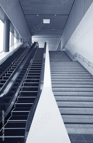 Interior view of escalator and stairway in modern architecture