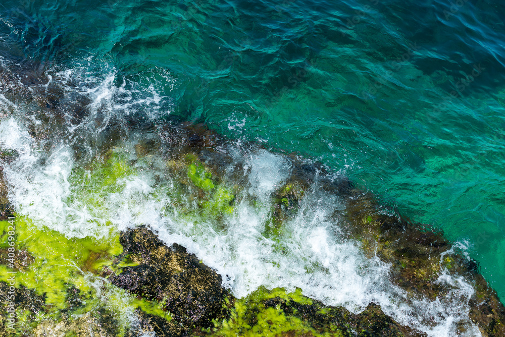 rock in the sea, blue waves, rocks, foam, raging sea, spray, top view down