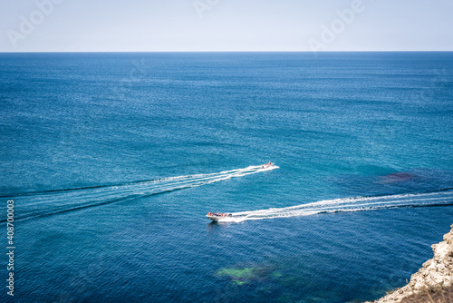 amazing view to two yachts or boats and clear dark blue water summer paradise. Copy space