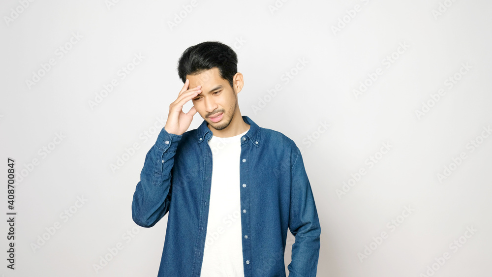 Young asian man doubting while standing over isolated grey background, Portrait of confused handsome asia guy, People negative gusture expression Young asian man doubting while standing over isolated grey background, Portrait of confused handsome asia guy, People negative gusture expression