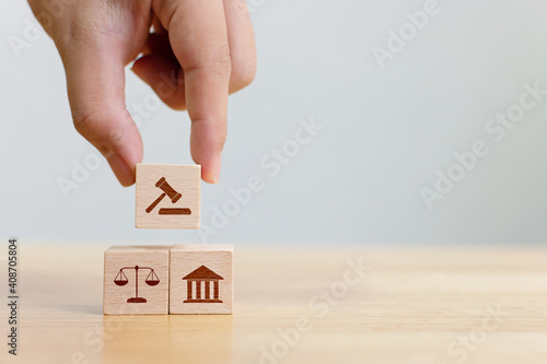 Φωτογραφία Wooden block cube shape with icon law legal justice