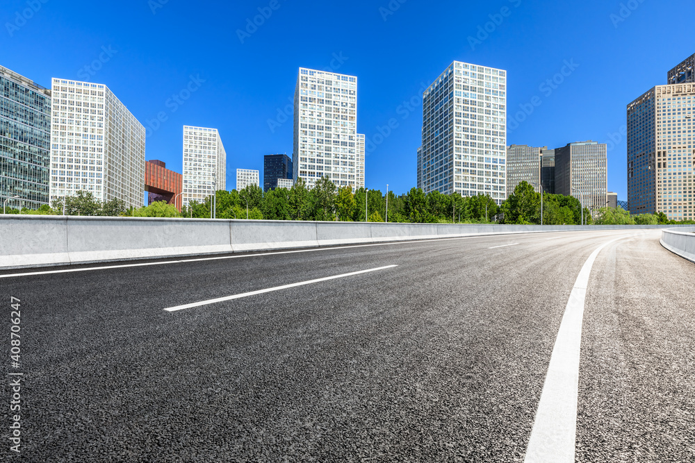 Asphalt road and modern city commercial buildings in Beijing,China. Asphalt road and modern city commercial buildings in Beijing,China.