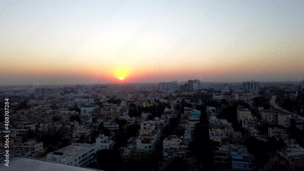 Time-lapse of sunset over Bangalore city with few clouds in the sky and orange teal tones. Time-lapse of sunset over Bangalore city with few clouds in the sky and orange teal tones.