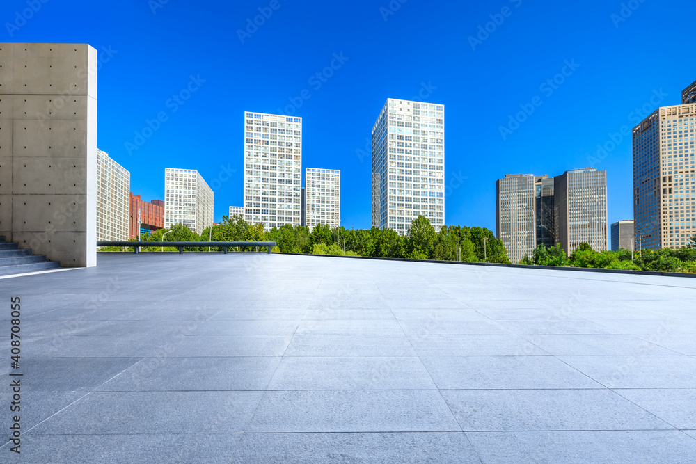 Empty square floor and modern city commercial buildings in Beijing,China.