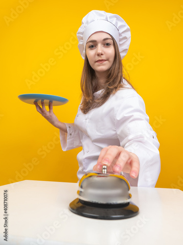 Young girl cook. Woman chef...