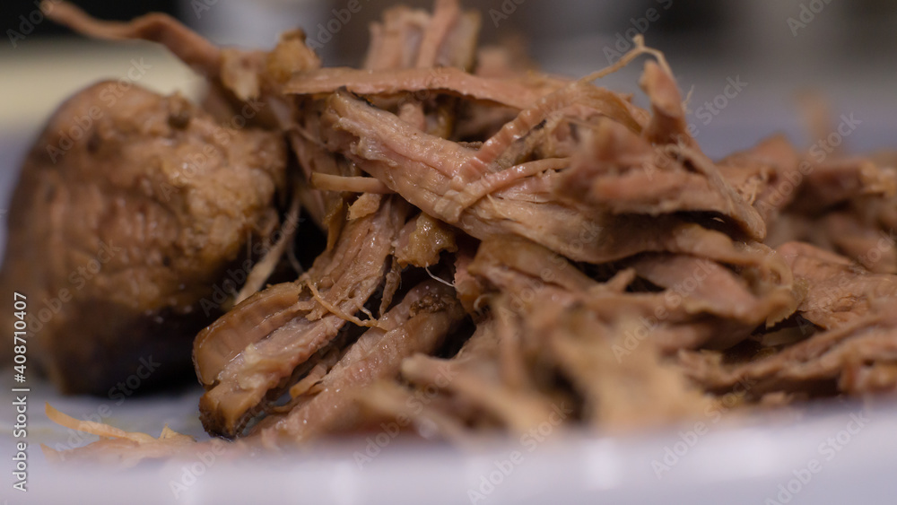 Separating the taco beef chunks into fibers Separating the taco beef chunks into fibers