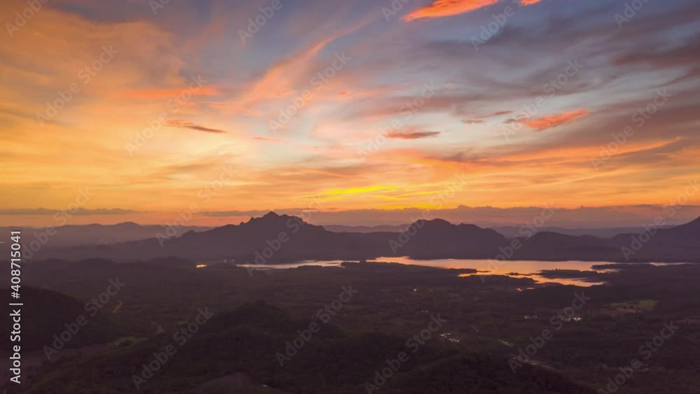 Hyper lapse 4K, Aerial view, evening view dramatic sky, sunset behind the mountains, colorfully, Mae Moh, Thailand. Hyper lapse 4K, Aerial view, evening view dramatic sky, sunset behind the mountains, colorfully, Mae Moh, Thailand.