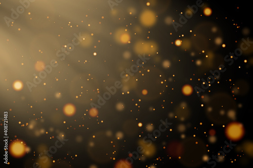 Defocused golden yellow lights or bokeh on black background.