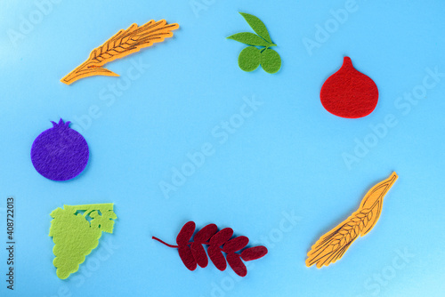 Fototapeta Naklejka Na Ścianę i Meble -  Jewish holidays greeting card with Seven species are traditionally eaten on Jewish holidays Tu Bishvat, Sukkot, and Shavuot.The seven species are all important ingredients in Israeli cuisine.