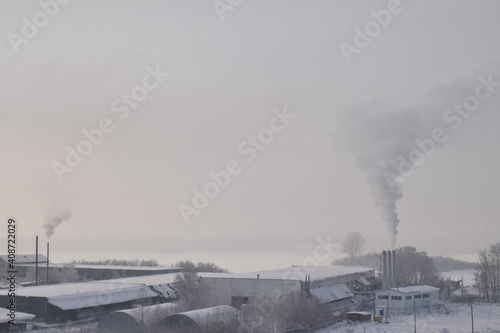 Smoke from the chimney, industrial landscape, bad ecology.