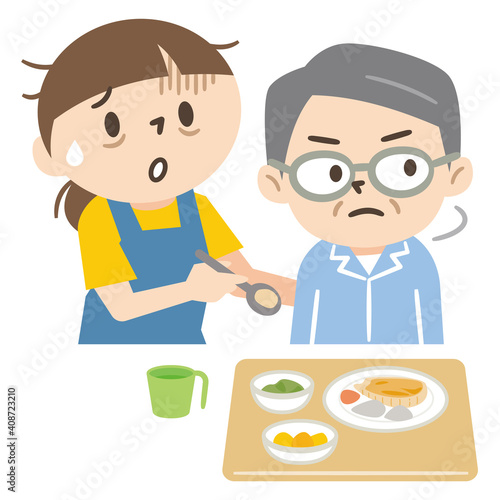 食事を嫌がる高齢男性と介護疲れの若い女性