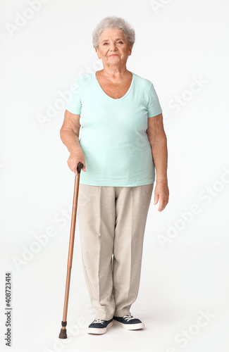 Senior woman with walking s...