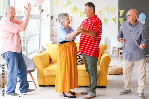 Senior people celebrating B...