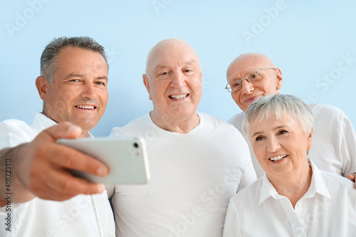 Senior people taking selfie...