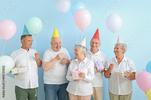 Senior people celebrating B...