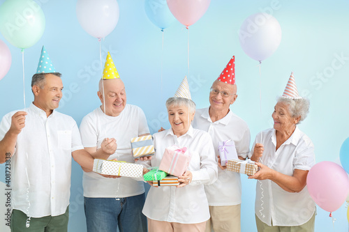 Senior people celebrating B...