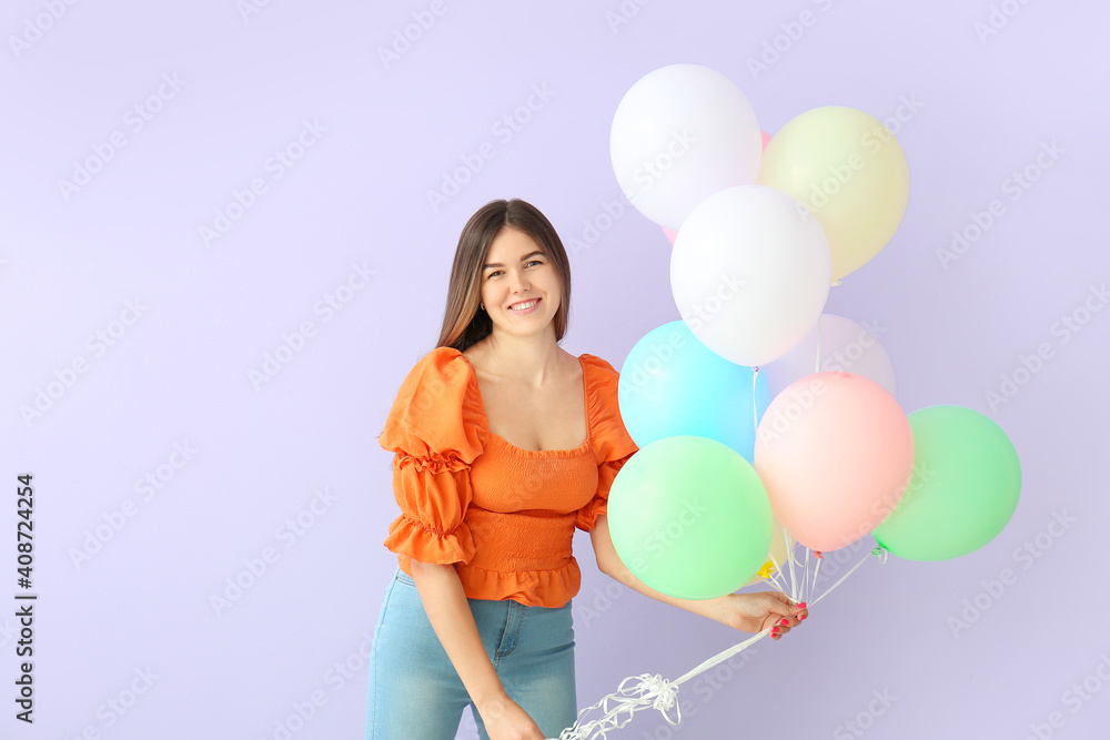 Beautiful young woman with balloons on color background Beautiful young woman with balloons on color background