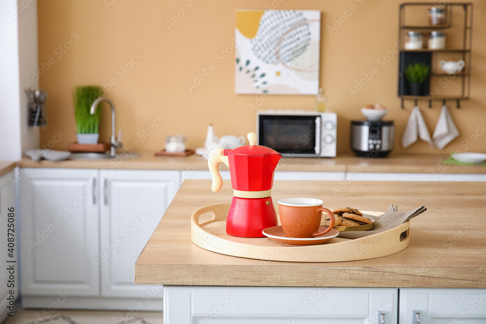 Tray with cezve, cup of coffee and cookies on kitchen counter Tray with cezve, cup of coffee and cookies on kitchen counter