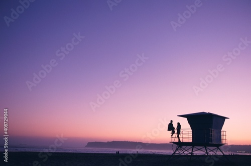 Couple on lifeguard tower at Coronado Beach, San Diego, San Diego County, California, USA photo