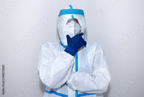 Doctor wearing medical protective suit, goggle, mask, and gloves. Protection mers by virus epidemic. Coronavirus (COVID-19). Healthcare concept. Think about.