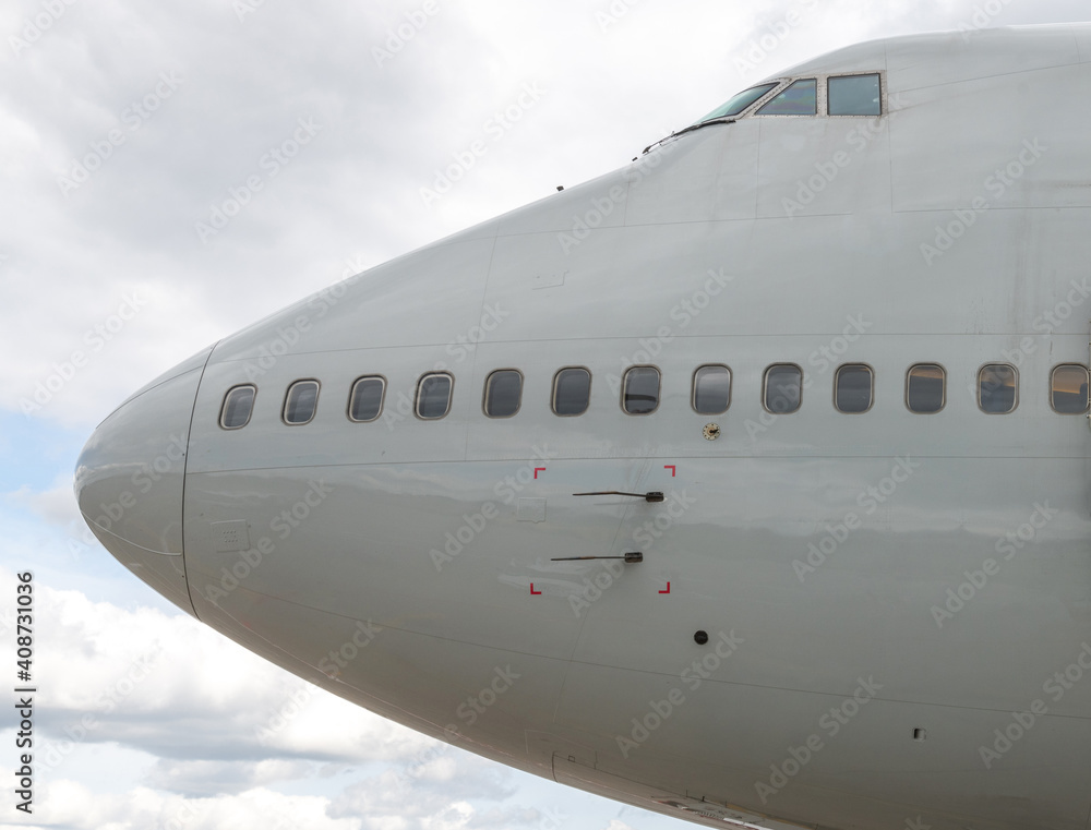 The nose of a grey passenger aircraft