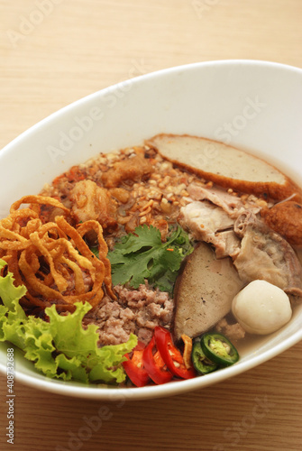 spicy noodles with fish ball and minced pork (Tom Yum Noodles) - Asian food style