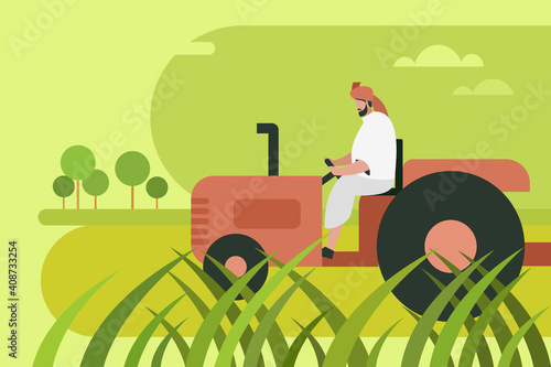 An Indian farmer driving a tractor in the agricultural field
