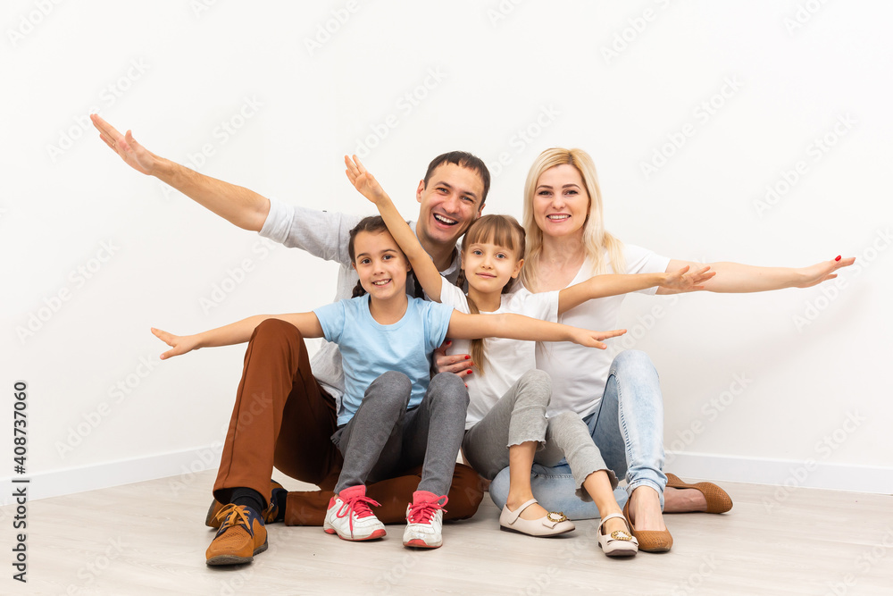 concept housing a young family. mother father and children in a new home concept housing a young family. mother father and children in a new home