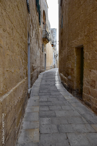 narrow street in the city © toKLabo