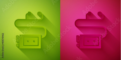 Paper cut Museum audio guide icon isolated on green and pink background. Headphones for excursions. Paper art style. Vector.
