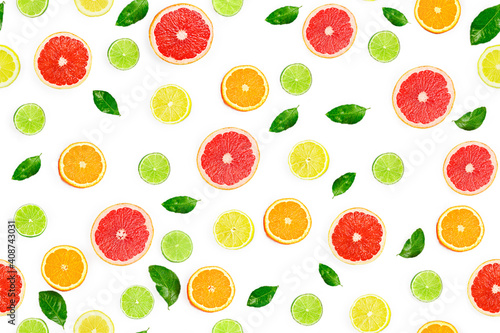 Flat lay composition with citrus fruits, leaves and flowers on white background, seamless pattern