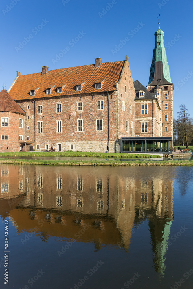 Historic castle and surrounding pond in Raesfeld, Germany