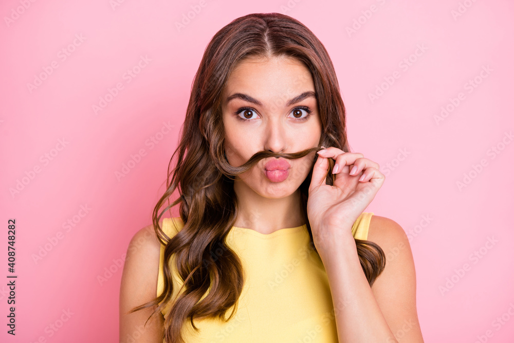Portrait of young beautiful pretty sweet attractive girl pout lips with fake mustache isolated on pink color background Portrait of young beautiful pretty sweet attractive girl pout lips with fake mustache isolated on pink color background