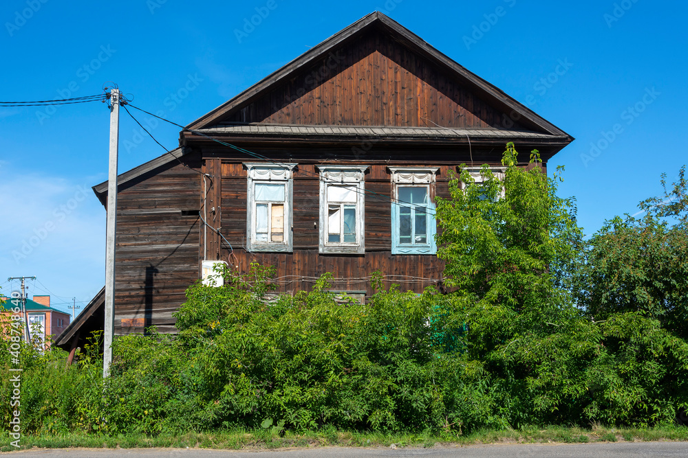 Mariinsky, an old wooden house in the historical center of the city Mariinsky, an old wooden house in the historical center of the city