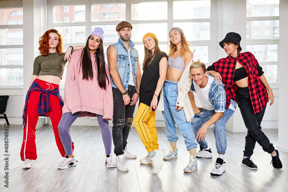 young people posing together with fun in studio, enjoy dance classes, hip-hop generation young people posing together with fun in studio, enjoy dance classes, hip-hop generation