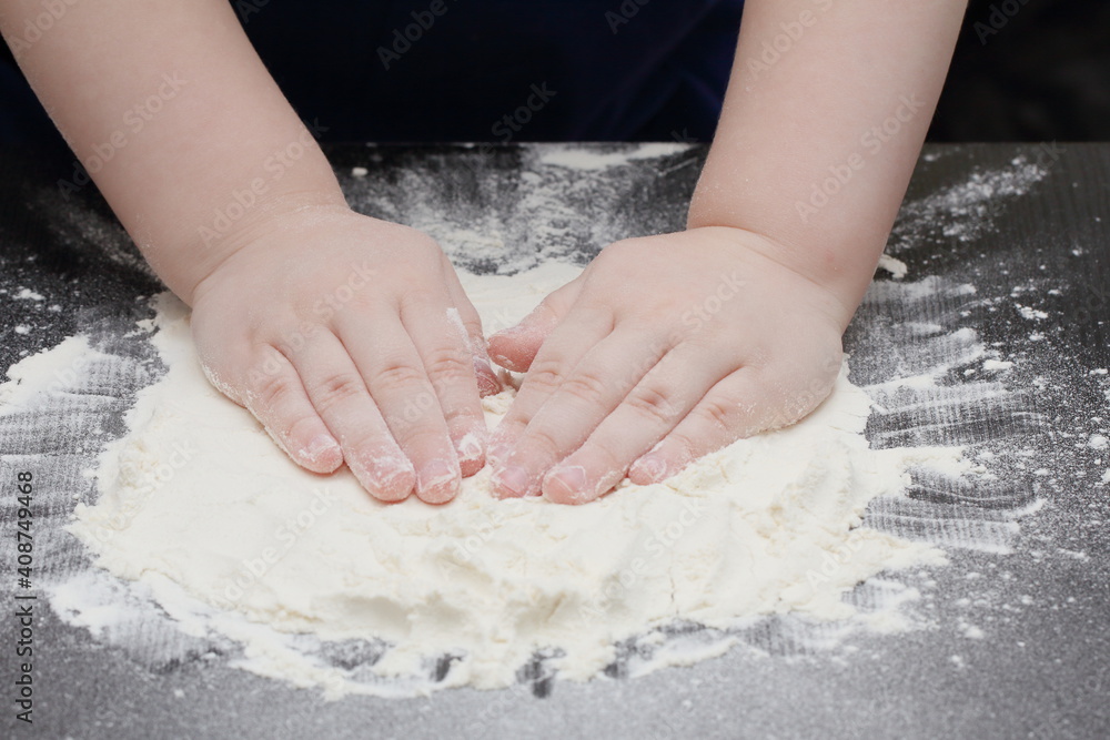 a child prepares cookie dough