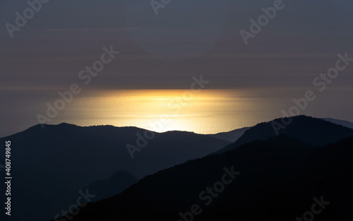 sunset in the mountains over the sea