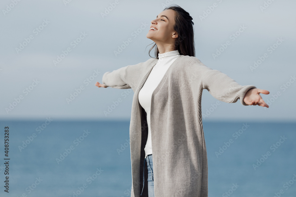 Happy young smiling woman outdoors. freedom and calm concept Happy young smiling woman outdoors. freedom and calm concept