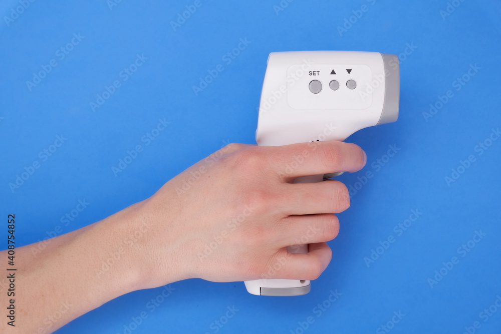 Digital thermometer in knob on blue background Digital thermometer in knob on blue background