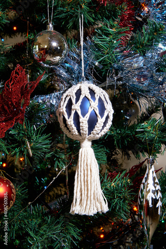 Macrame hand made one ball  decoration on a Christmas Tree. 