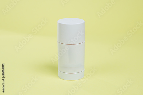 a real Deo stick with a place logo on a yellow, colored background