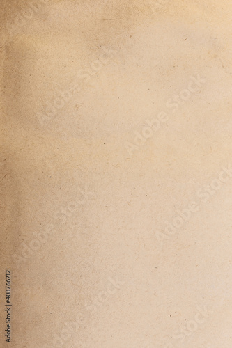 Vintage abstract background with texture of shabby yellowed brown cardboard paper with blank page of old book, blank with copy space for text in retro style