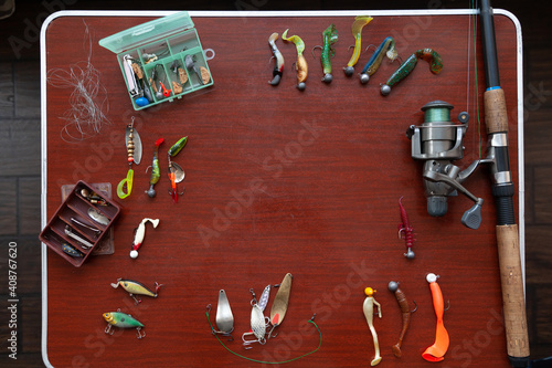 set of artificial baits for pike fishing lies on table photo