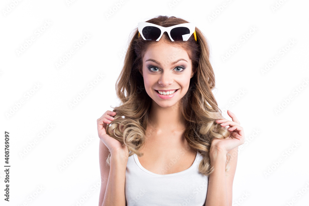 Beautiful cute smiling woman in sunglasses on her head on a white background. Beautiful cute smiling woman in sunglasses on her head on a white background.