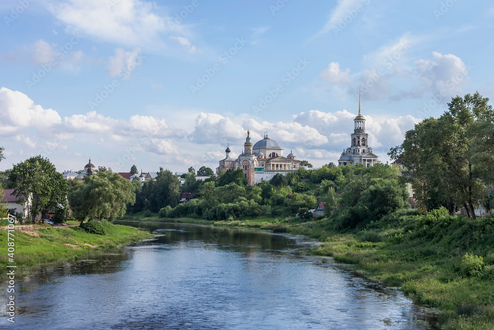 Ancient Russian city with churches on the river bank